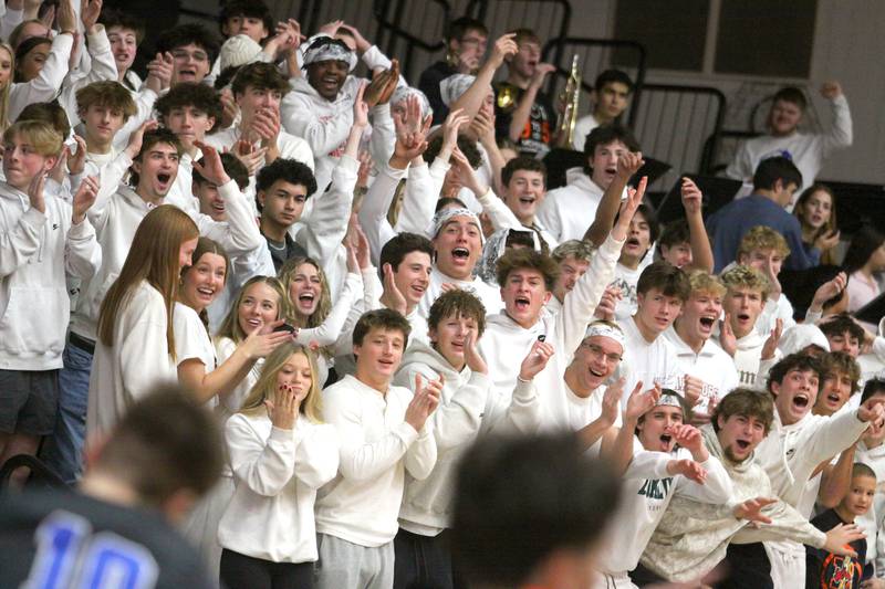 McHenry’s fans react as the Warriors tie the game at 18 in the second quarter against Burlington Central in varsity boys basketball on Friday, Dec. 5, 2025, at McHenry Community High School in McHenry.