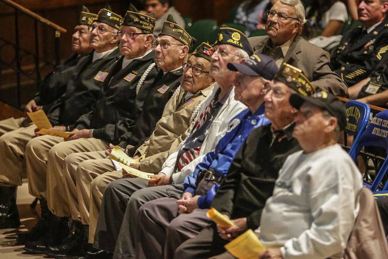 Veterans listen during a ceremony Friday at Joliet Central High School in Joliet. There are numerous other Veterans Day events scheduled for both Will and Grundy counties throughout the week.