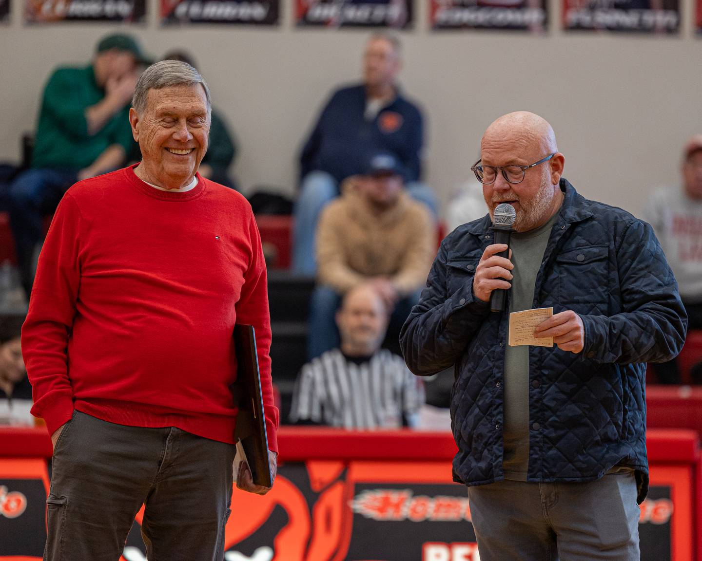 Jimmy Thompson speaks during his induction ceremony at the 2026 Hall High School Hall of Fame as former coach Gary Carruthers watches with a smile on Saturday, January 31, 2026 at Hall High School in Spring Valley.
