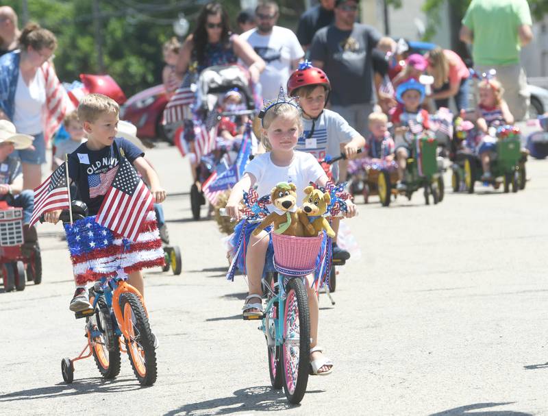 Kids head out on their decorated bikes at the start of the 2022 Let Freedom Ring's Kiddie Parade.