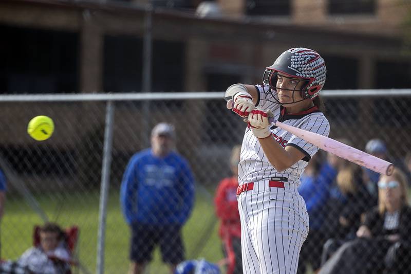 Fulton’s Zoe Kunau eyes the ball and drives in two against Newman Tuesday, May 19, 2026, at the Class 1A softball regionals at Newman.