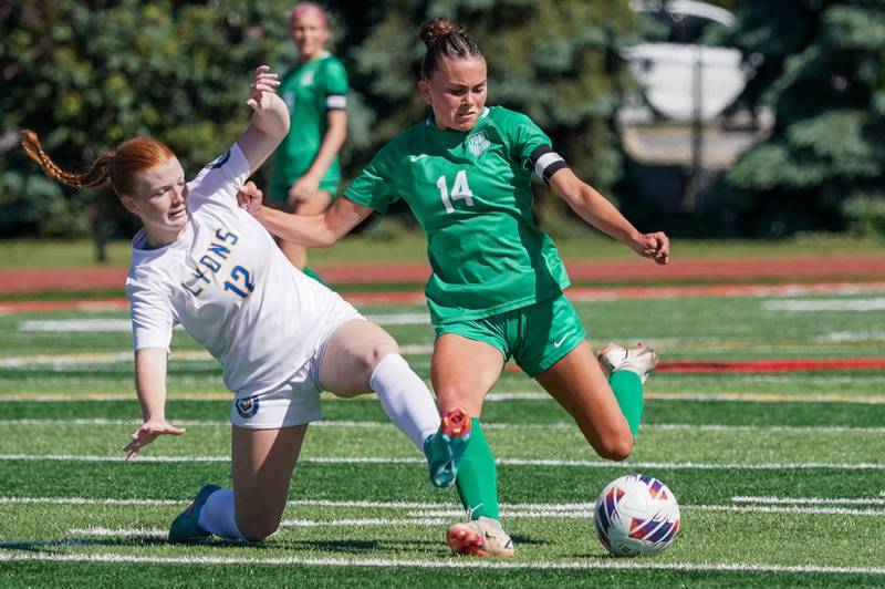 Lyons’ Izzi Wirtz (12) challenges York’s Michaela Quinn (14) for the ball during a Class 3A Hinsdale Central Sectional girls soccer championship match at Hinsdale Central High School on Saturday, May 25, 2024.