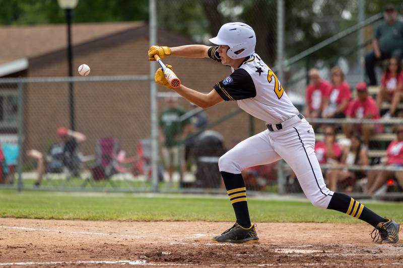 Bryan Degen (22) of Iowa bunts on Thursday, July 17, 2025 at Washington Park in Peru.