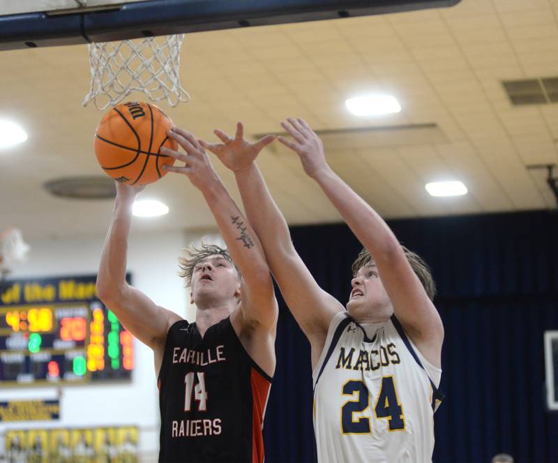 Earlville's Adam Waite (14) and Polo's Aiden Messer (24) rebound during a Monday, Feb. 10, 2025 game at Polo High School.