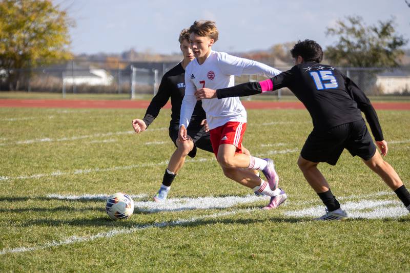 South Elgin's Jacob Buthman looks to control the ball past St. Charles North's Wicho DelaPaz at the Class 3A Sectional Final on Saturday, Nov. 1,2025 in South Elgin.