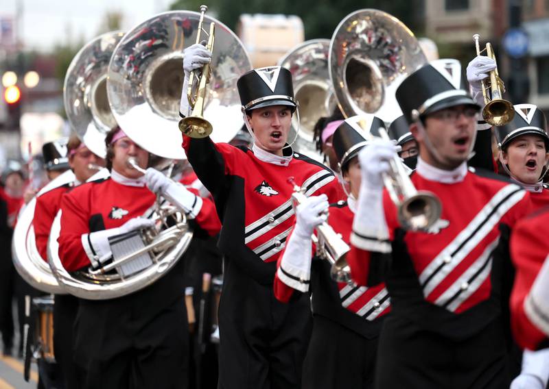 The Northern Illinois University marching band heads down Lincoln Highway in the March of the Huskies parade during the NIU Huskie Homecoming Block Party Thursday, Oct. 12, 2023, in downtown DeKalb.