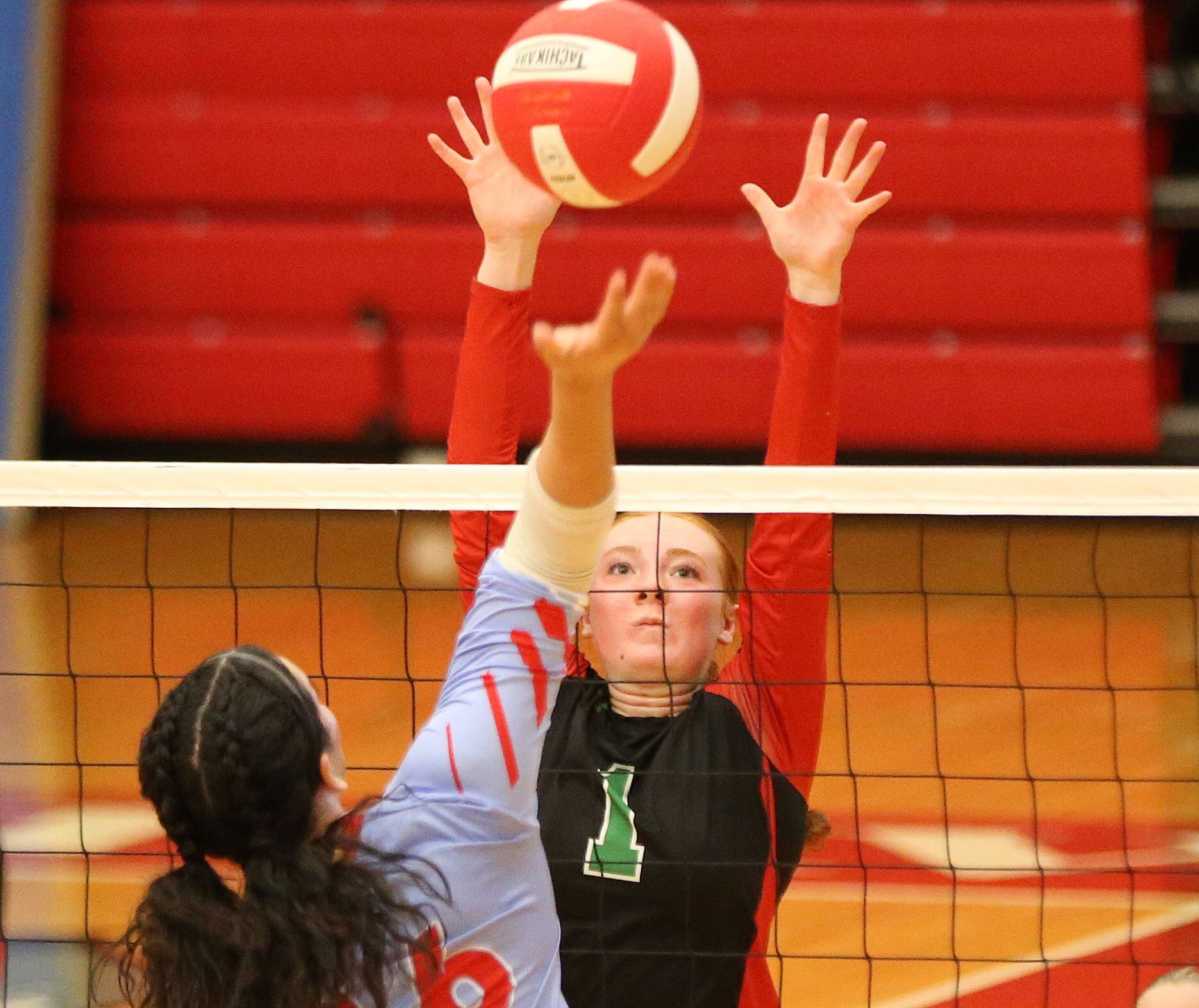 L-P's Addison Duttlinger blocks a spike from Ottawa's Chey Joachim on Thursday, Sept. 21, 2023 at Kingman Gym.
