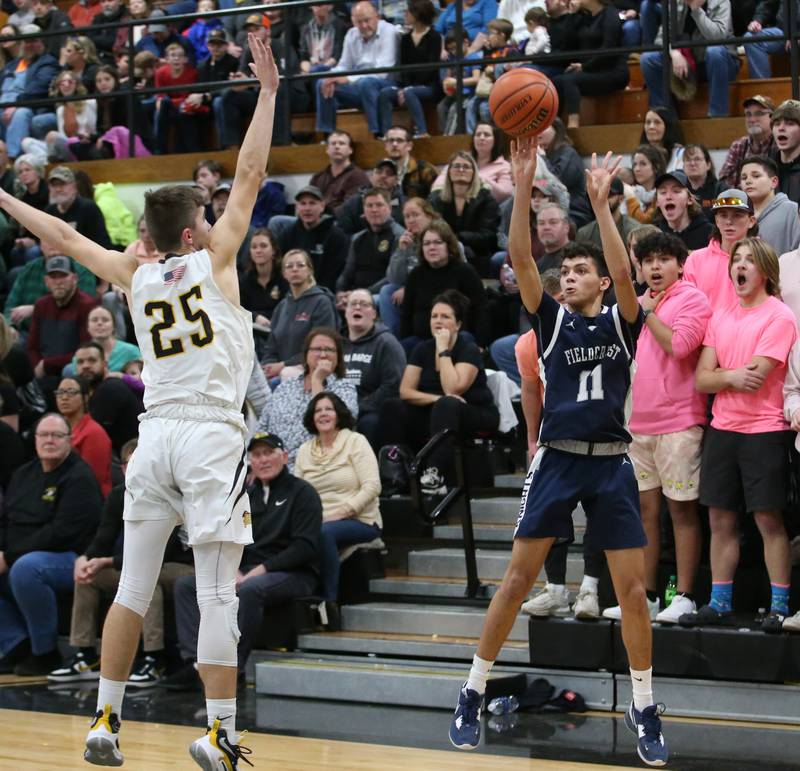 Fieldcrest's Jozia Johnson shoots a shot over Putnam County's Wyatt Grimshaw on Tuesday, Feb. 7, 2023 at Putnam County High School.