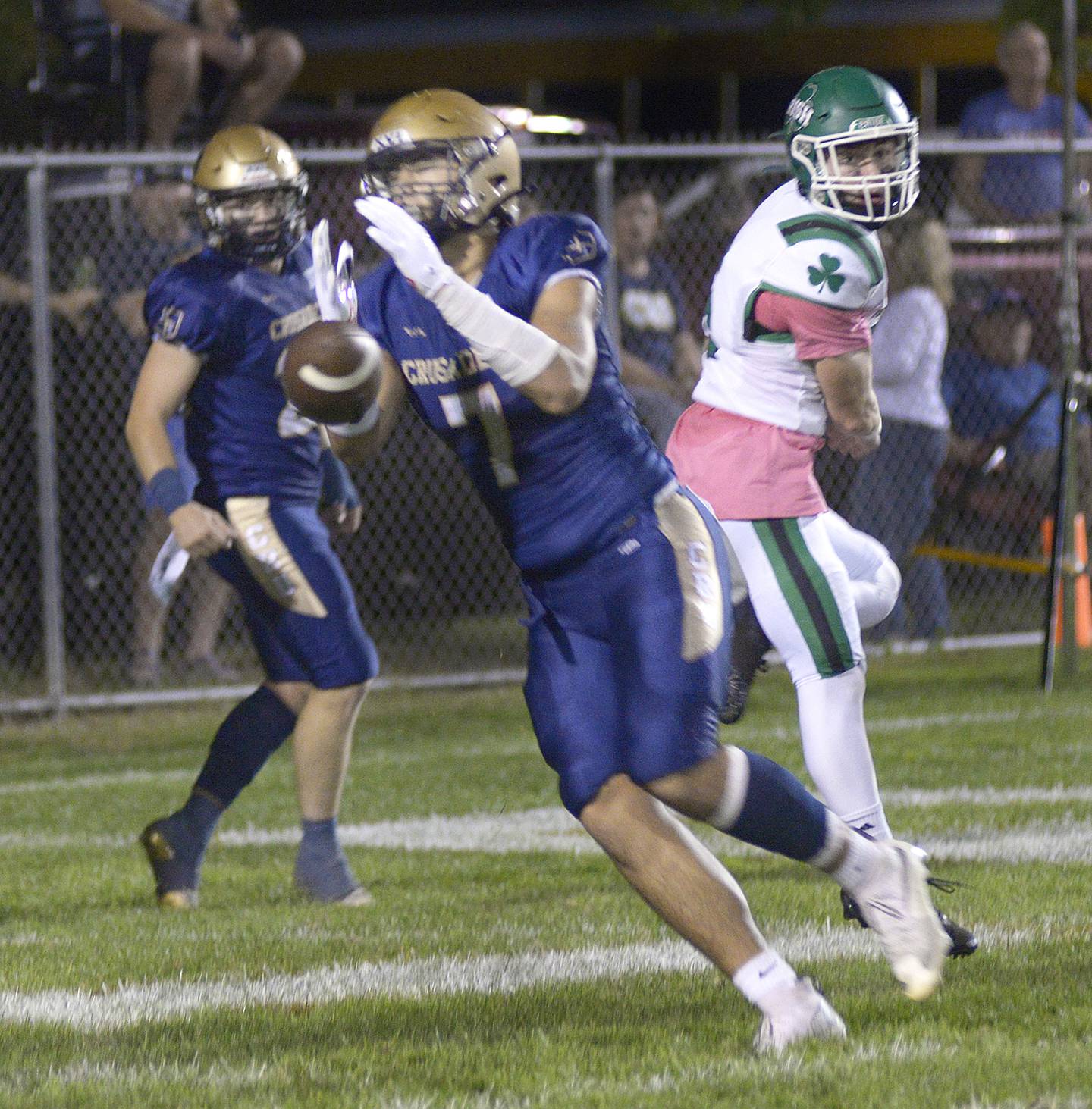 Marquette’s Brayden Cassel tries to hang on to the ball as the Crusader’s try for a two point conversion in the1st quarter Friday against Seneca at Marquette.