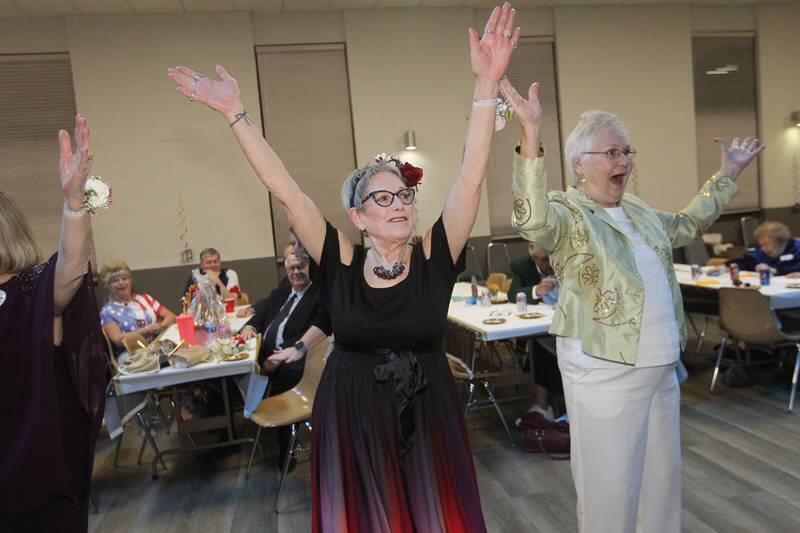 Carol Posa and Linnae Glestae dance during the Senior Prom to celebrate the 50th Anniversary of Leisure Village in Fox Lake.