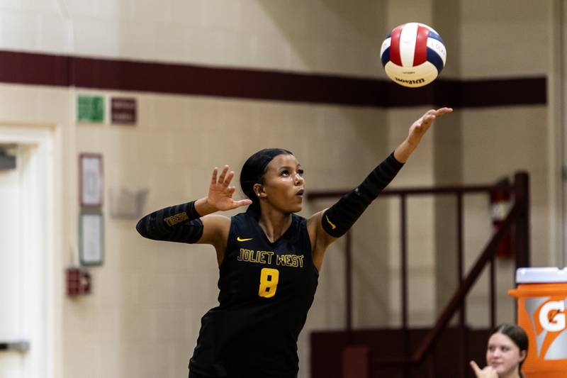 Joliet West's Eden Eyassu serves during a varsity volleyball away game against Lockport on Sept. 17, 2025.