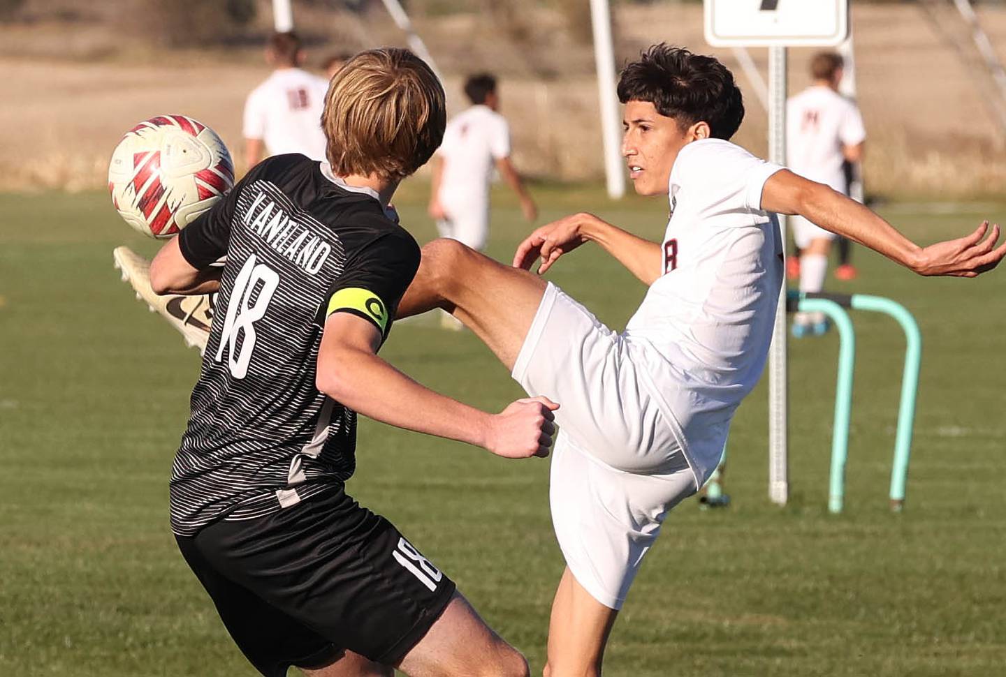 DeKalb's Erick Talamantes tries to kick the ball over Kaneland's Matthew Mitchinson during their game Thursday, Oct. 17, 2024, at Kaneland High School in Maple Park.