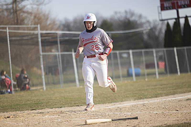 Oregon’s Seth Rote comes in to score against Amboy Thursday, March 21, 2024 in Oregon.