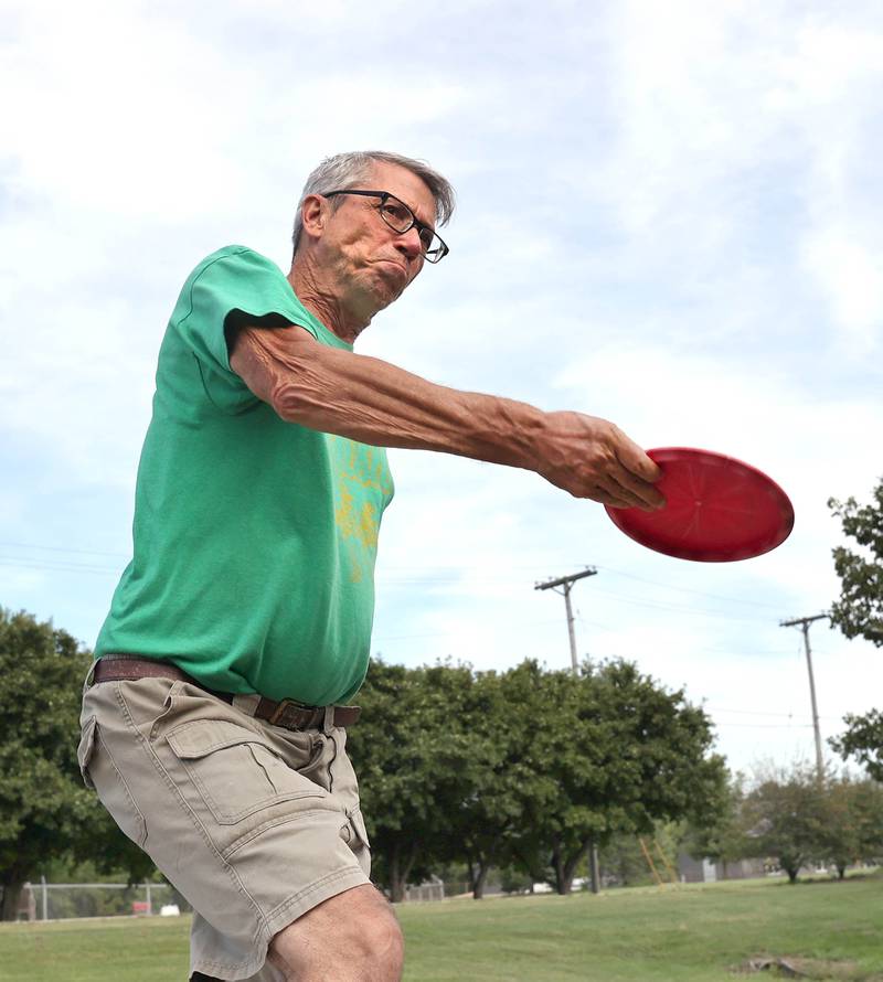Brian Wallace, with the Kishwaukee Valley Wanderers, makes his first throw of the day Thursday, Sept. 2, 2022, at the new River Run Disc Golf Course in David Carroll Memorial Park in Genoa.