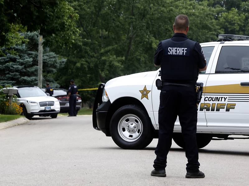 Officers from the McHenry County Sheriff and other departments investigate a domestic incident in which four people were killed on Wednesday Aug. 9, 2023, in the 5800 block of Wild Plum Road in unincorporated Crystal Lake. Police later said they were family members.