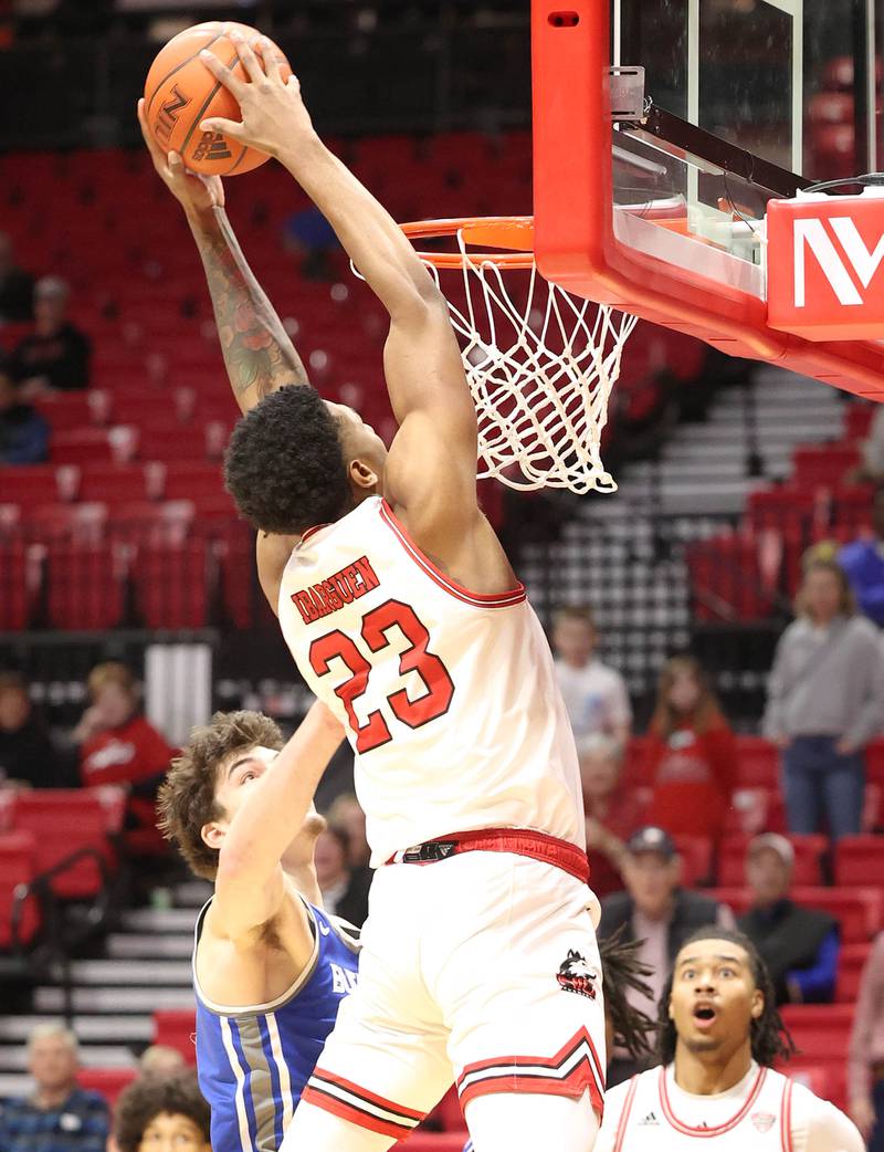 Northern Illinois Huskies forward Harvin Ibarguen dunks over Buffalo Bulls center Isaac Jack Tuesday, Feb. 28, 2023, during their conference matchup at the Convocation Center at NIU.