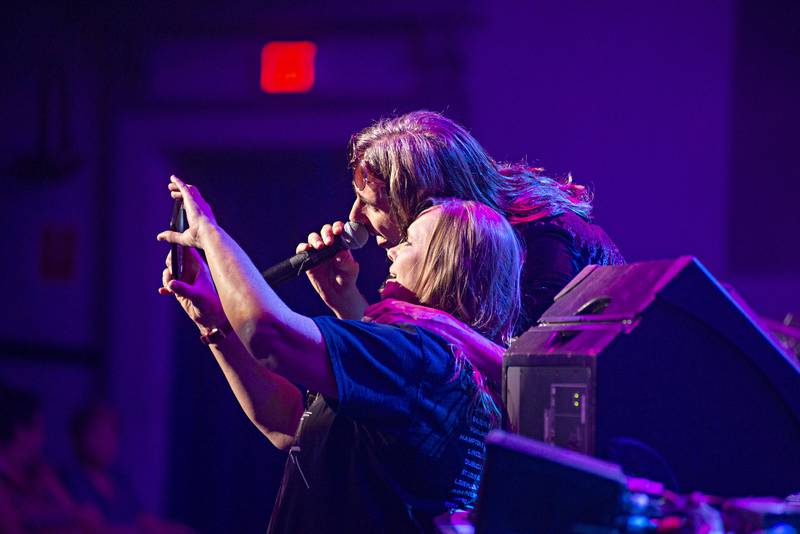 A fan snaps a selfie with lead vocalist Chandler Mogel Friday, Aug. 19, 2022.