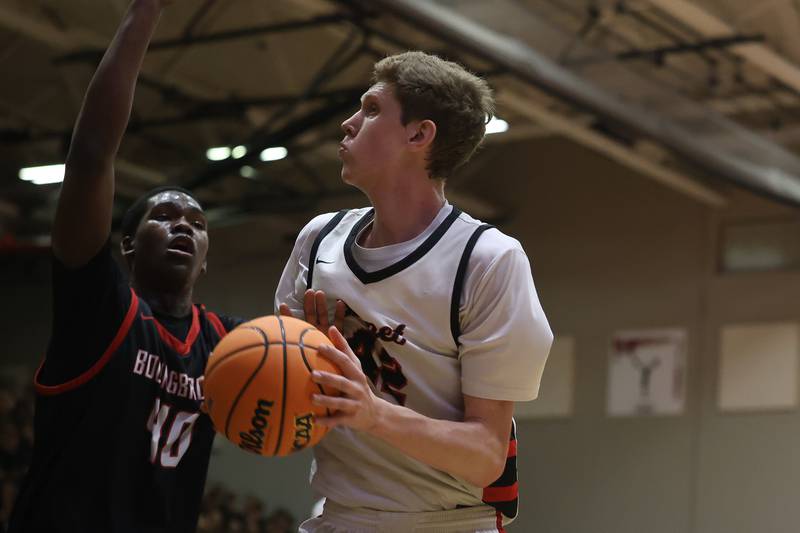 Benet’s Colin Stack looks to make a play under the basket against Bolingbrook in the Class 4A Bolingbrook Sectional championship game on Friday, March 6, 2026 in Bolingbrook.