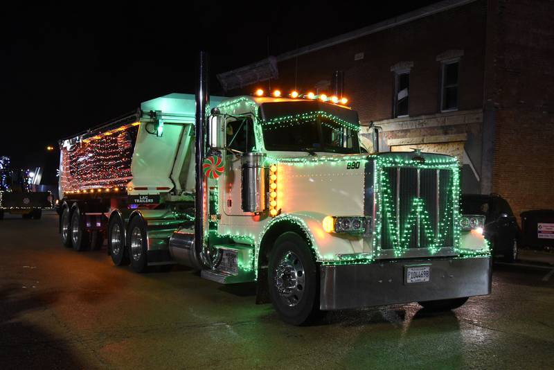 R.E. Wolber & Sons drive their decorated entry in the lighted parade, held Saturday, Dec. 2, 2023 in Mt. Morris.