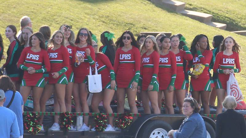 L-P cheerleaders ride on a float during the L-P Homecoming parade on Thursday, Sept. 26, 2024 near the corner of 7th Street and Orleans Street in Peru.
