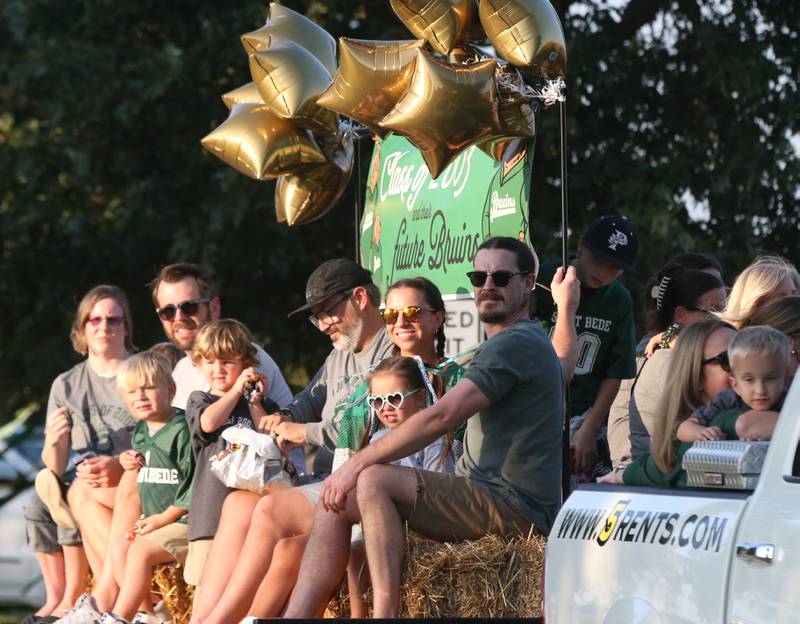 The St. Bede class of 2003 and other future Bruins ride in the St. Bede Homecoming Parade on Friday, Sept. 29, 2023 at St. Bede Lane.