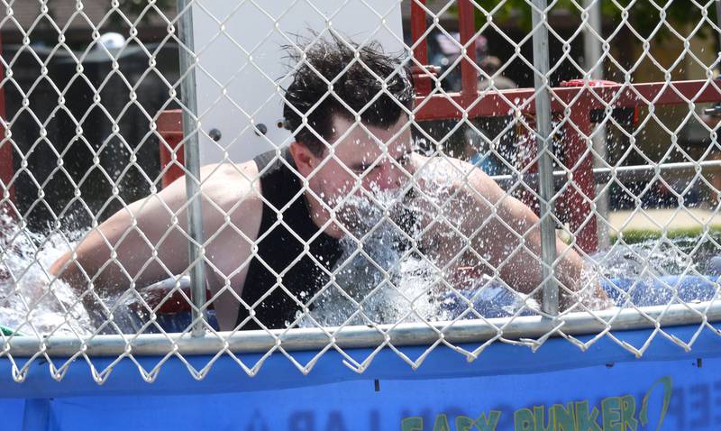 Zach Slick makes a splash in the dunk tank at Sauerkraut Days in Forreston on Saturday, Aug. 2, 2025.