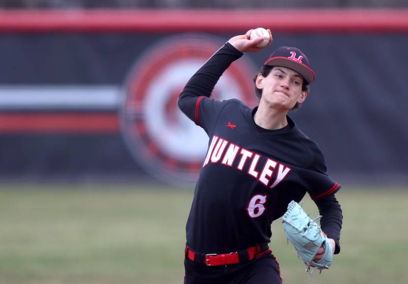 Huntley’s Josh Rudnick delivers in varsity baseball at Barrington Saturday.