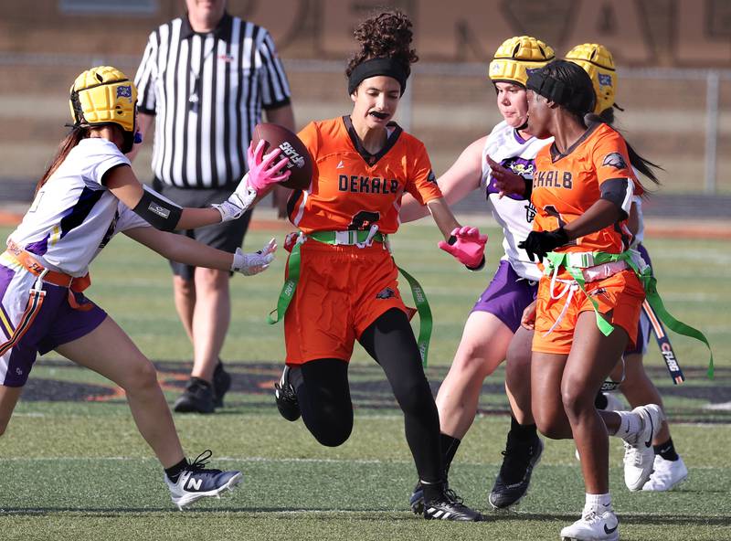 DeKalb's Maryam Abuikhdair returns a punt Monday, Aug. 25, 2025, during their game against Belvidere at DeKalb High School. The contest marked the first ever game for the girls flag football program at DeKalb.