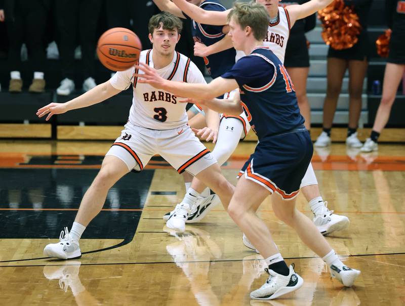 DeKalb’s Brayson Barnhardt guards Naperville North's Max Steele during their game Friday, Dec. 8, 2023, at DeKalb High School.