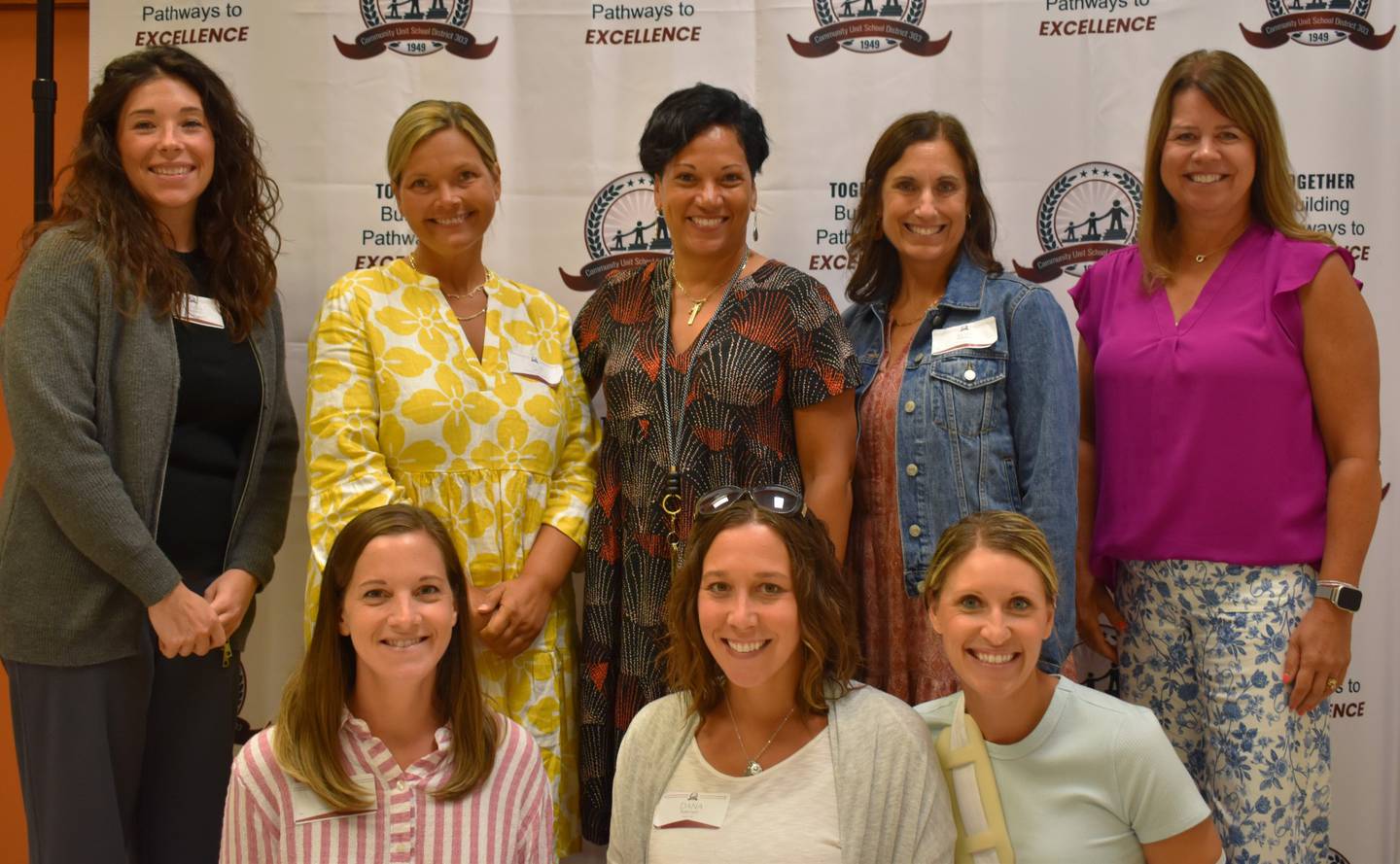 New Wasco Elementary School staff members, including new principal Christine O'Neil (back middle), pose for a picture during the St. Charles School District 303 orientation luncheon on Aug. 4, 2025.