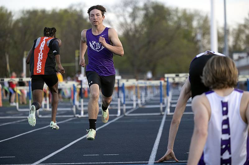 Dixon’s Tyson Dambman finishes his leg of the 110 boys shuttle hurdle relays Thursday, April 27, 2023  at the Sterling Night Relays.