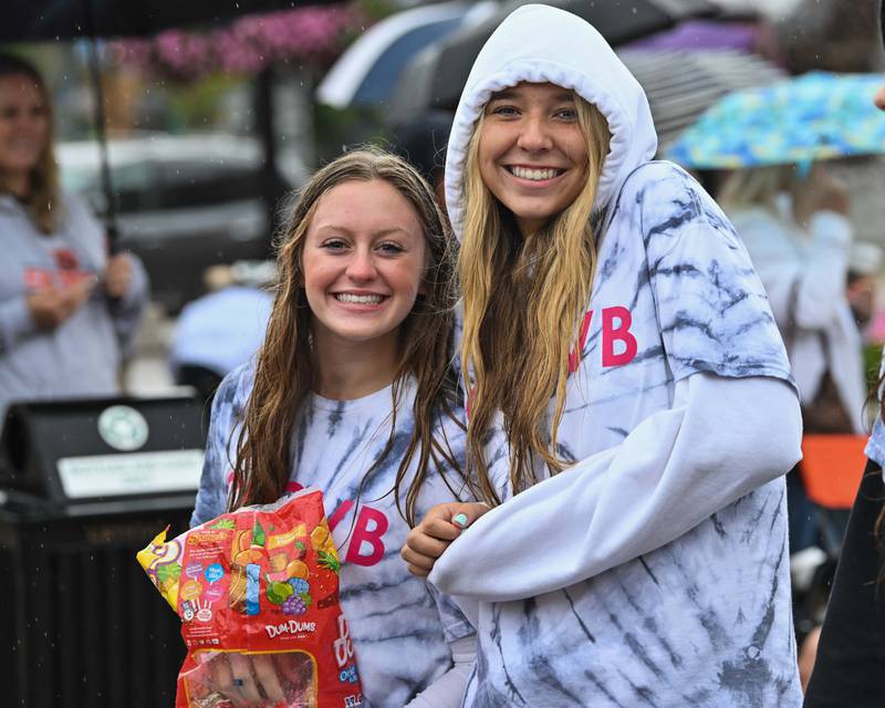 Members of the Crystal Lake Central H.S. girls volleyball team seen in downtown Crystal Lake during the school's 100 year anniversary homecoming day parade on a rainy Saturday, Sep. 16, 2023 in Crystal Lake. The parade began at the high school and made its way through downtown Crystal Lake.