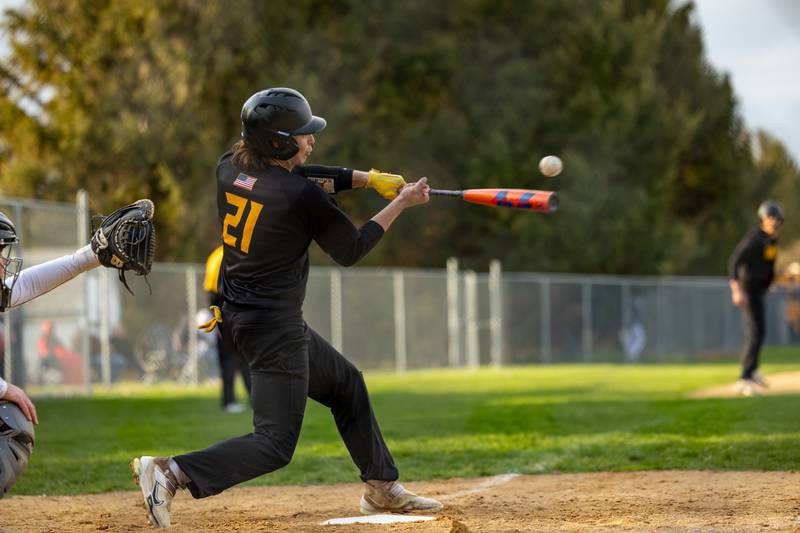 Tayton Kays (21) Putnam County hits ball on Thursday, April 17, 2025 at Woodland High School in Streator.