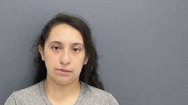 Oswego woman charged after leaving three young children at home alone