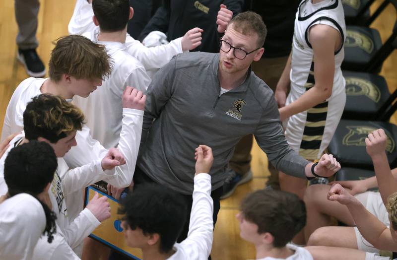 Sycamore head coach Ethan Franklin talks to his team before tipoff of their game against Kaneland Friday, Feb. 10, 2023, at Sycamore High School.