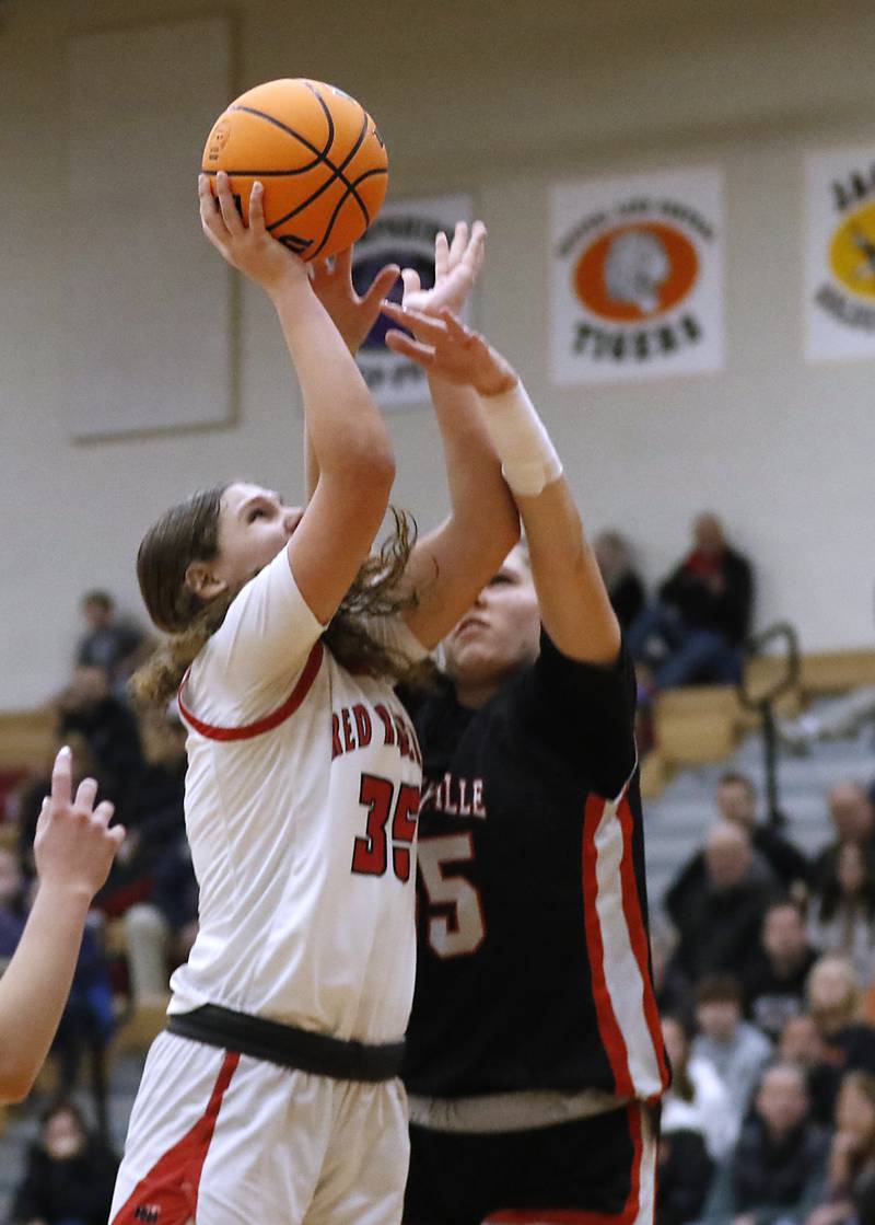 Huntley's Paula Strzelecki shoots the ball over Libertyville's Madison Sears during the IHSA Class 4A Huntley Sectional Championship girls basketball game on Thursday, Feb. 27, 2025, at Huntley High School.