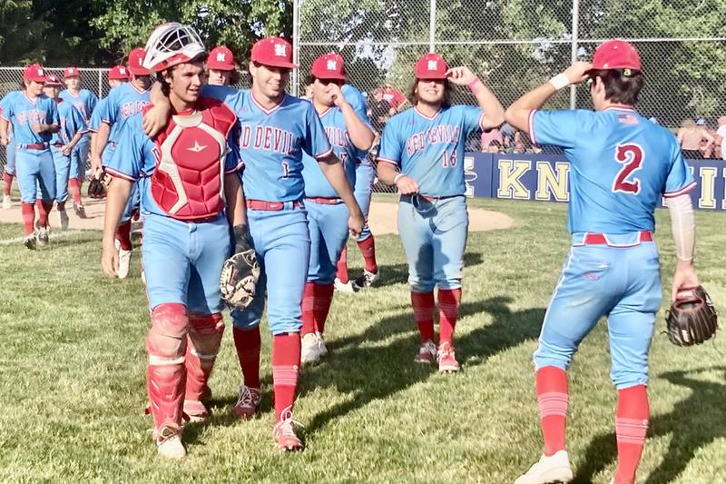 Hall first baseman Dom Galetti puts his arm around catcher Kyler Lapp as the Red  Devils walk off in smiles after defeating the Lewistown Valley Cuba co-op 1-0 in Thursday's Class 2A sectional semifinals in Knoxville.