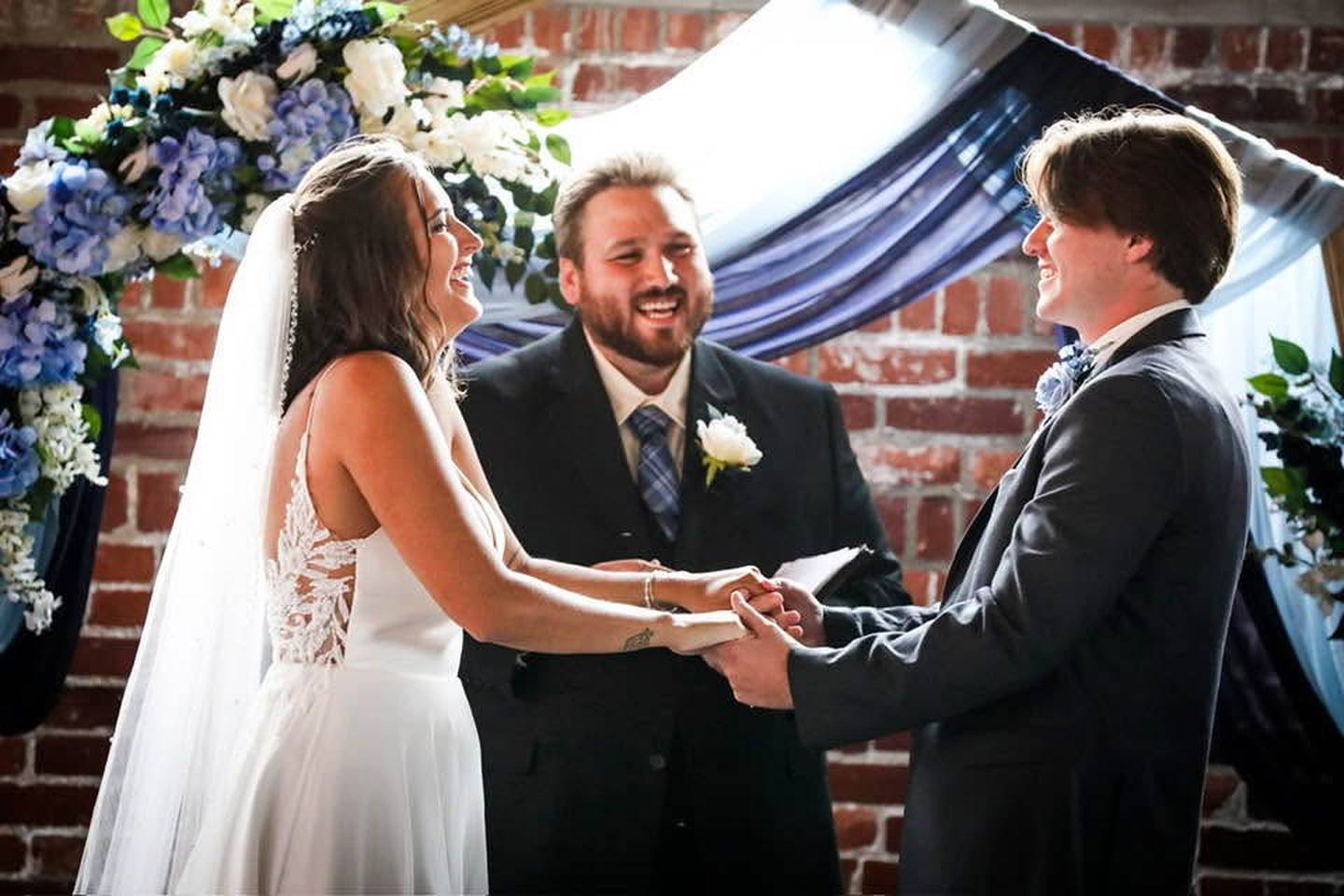 Sean Curbow serves as the officiant for a wedding.