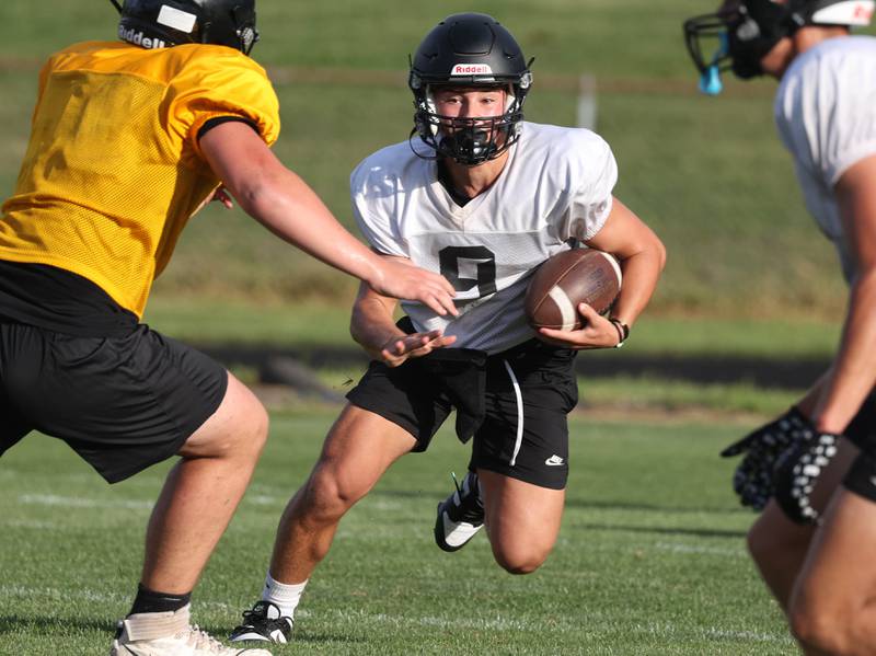 Sycamore’s Griffin Larson carries the ball as they scrimmage Lena-Winslow Thursday, July 24, 2025, during a joint practice with Byron, Lena-Winslow and Sycamore at Sycamore High School.