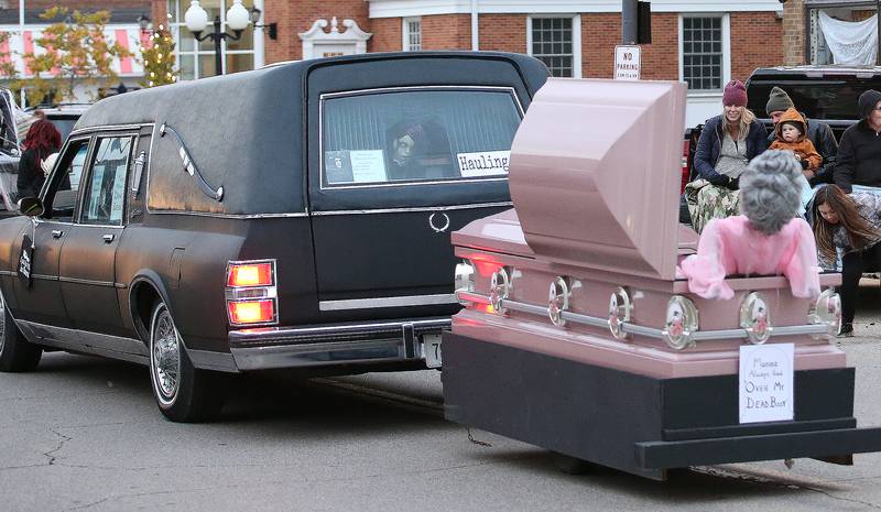 A fake character rides in the back of a coffin during the 5th annual Halloween Parade on Saturday, Oct. 28, 2023 downtown Princeton.