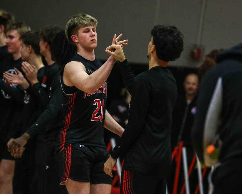 Yorkville's Frankie Pavlik (21) is introduced during pregame introductions during their Class 4A Bolingbrook Sectional semifinal basketball game between Yorkville at Benet, March 3, 2026 in Bolingbrook.