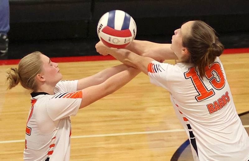 DeKalb's Isabelle Smith (left) and DeKalb's Kailey Porter combine to keep the ball alive during their match against Indian Creek Tuesday, Sept. 6, 2022, at Indian Creek High School in Shabbona.