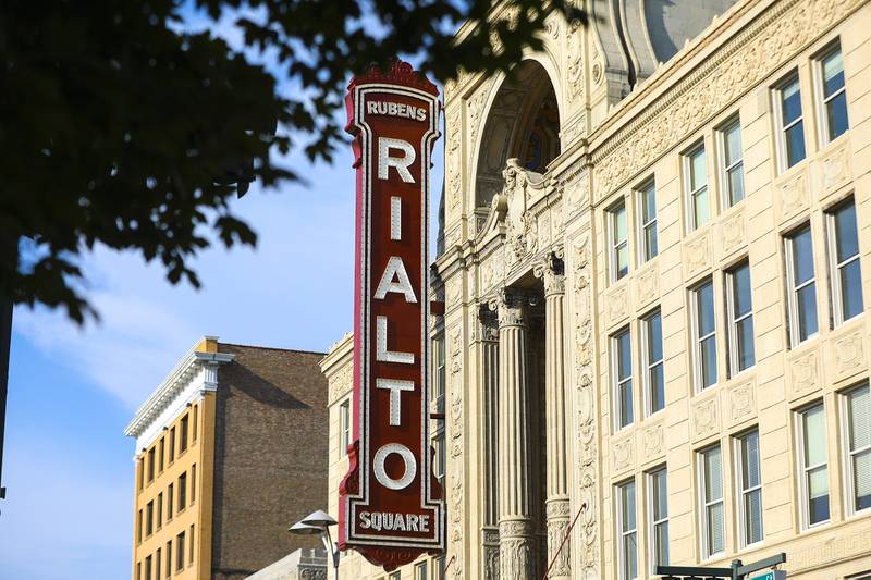 The sun sets over the Rialto Square Theatre in Joliet, Ill.