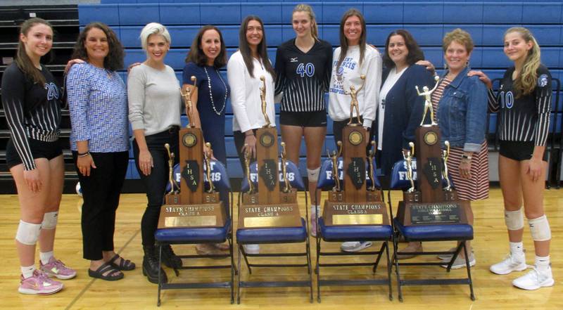 Alumni and current St. Francis players will celebrate four championship teams at the Sept. 29 home match against St. Charles North – (from left) Cece Gilroy, head coach Lisa Ston, Noel (Olson) Williams (2002 team), Beth Rodriguez DiMario (1997), Molly Haggerty (2012), Jess Schmidt, Maddie Haggerty (2012), assistant coach Erin Kopec Tuttle (1997), former head coach Peg Kopec and Anna Paquette. (Bill Stone photo)