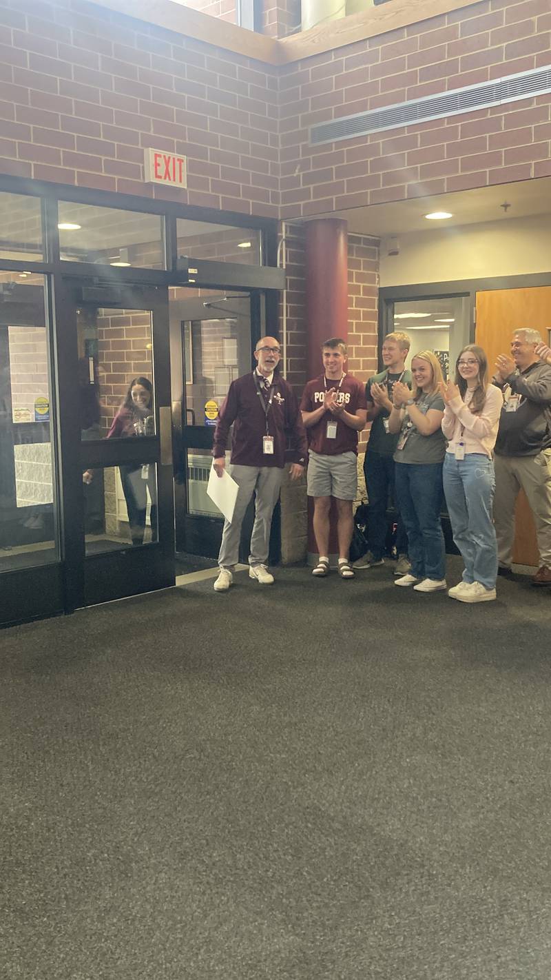 District 205 Superintendent Dr. Robert McBride walks into a surprise send-off celebration for his trip to the Boston Marathon Friday, April 17, 2026.