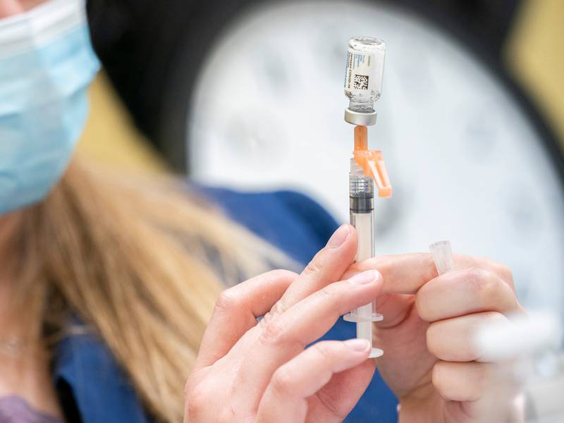 A McHenry County Health Department employees prepares to administer a COVID-19 vaccine in 2021. The health department was notified in March 2025 that it lost a federal grant for $600,000 amid cuts President Donald Trump's administration.