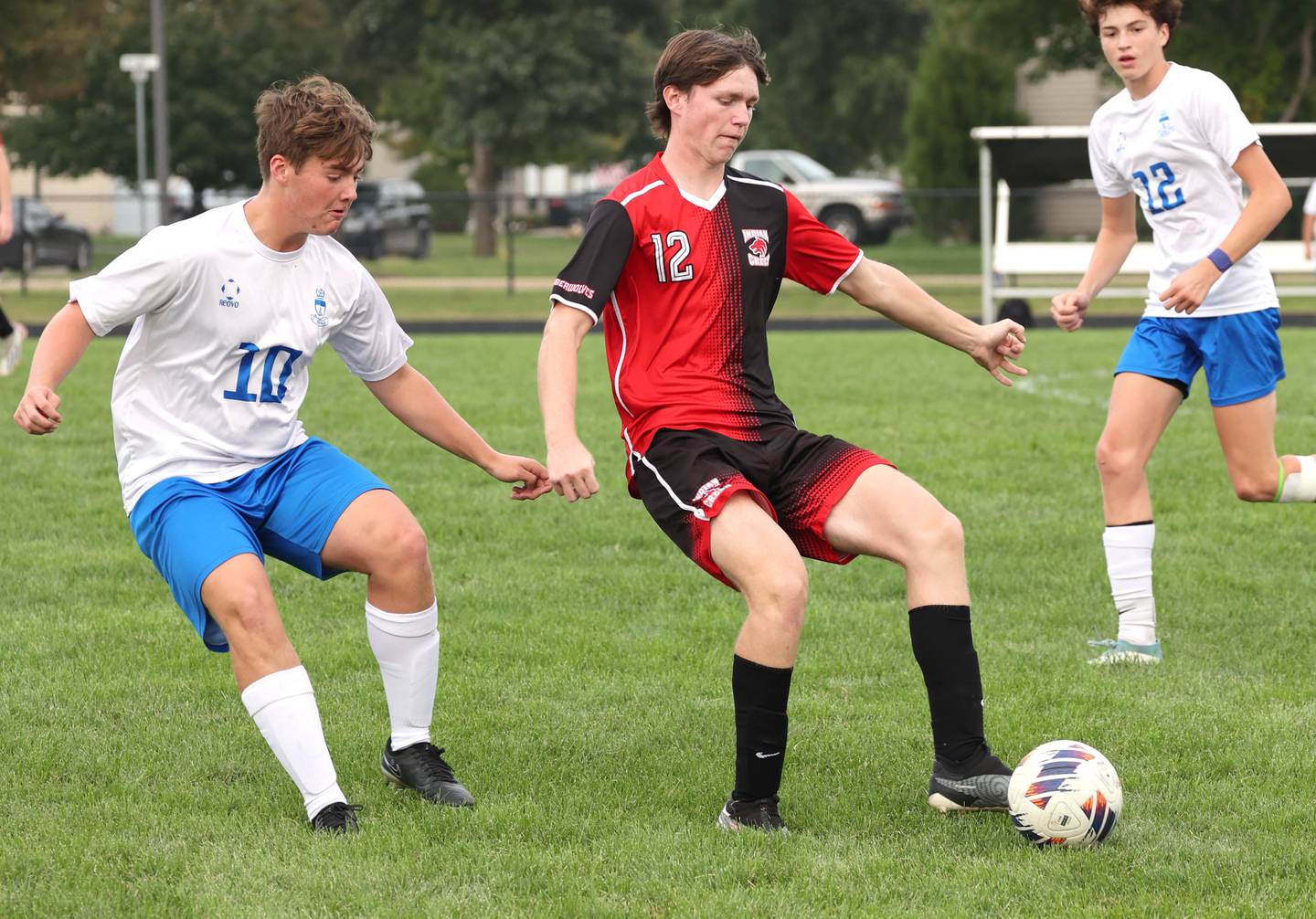 Indian Creek's Jakob McNally keeps the ball away from Hinckley-Big Rock's Austin Roop during their game Wednesday, Sept. 20, 2023, at Pack Park in Waterman.