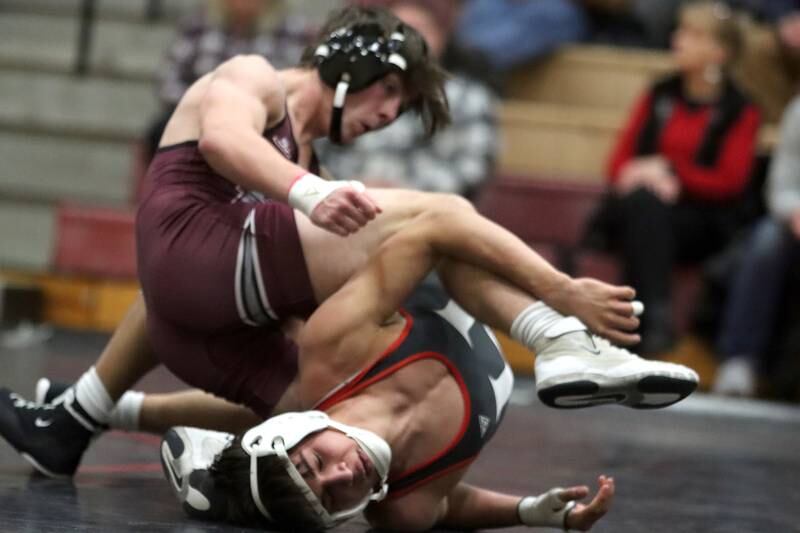 Huntley’s Julian Gutierrez, bottom, battles Prairie Ridge’s Mikey Meade at 126 pounds in varsity wrestling on Thursday, Jan. 23, 2025, at Huntley High School in Huntley.