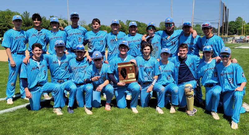 Members of the Marquette baseball team pose with the Class 1A Regional plaque after defeating St. Bede 4-0 to win the Class 1A Regional title on Saturday, May 20, 2023 at Masinelli Field in Ottawa. The Crusaders win their 7th consecutive Class 1A Regional championship.