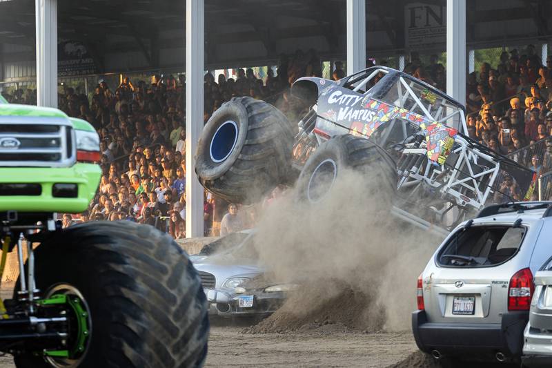 Catty Wampus driver Chris Keyes rolls kicks up dirt Thursday, August 17, 2023 during the Full Throttle Monster Truck show at the Whiteside County Fair.